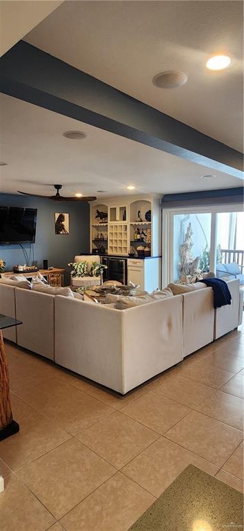 6201 Padre Blvd Unit 308, South Padre Island, TX 78597 - living room with light tile patterned floors, wine cooler, and recessed lighting