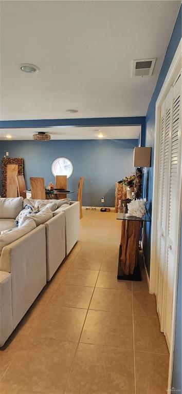 6201 Padre Blvd Unit 308, South Padre Island, TX 78597 - living room featuring light tile patterned floors