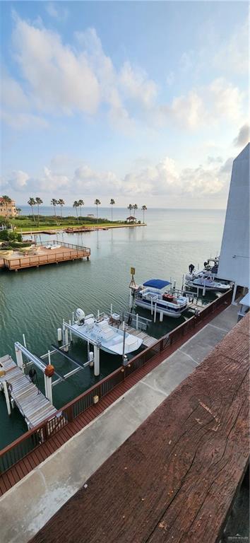 6201 Padre Blvd Unit 308, South Padre Island, TX 78597 - dock featuring a water view and boat lift