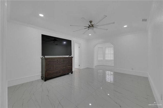 unfurnished living room featuring ceiling fan and ornamental molding