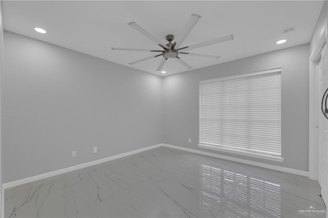 spare room with ceiling fan