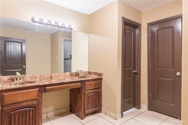 bathroom with tile patterned floors and vanity