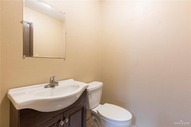 half bath with toilet and vanity