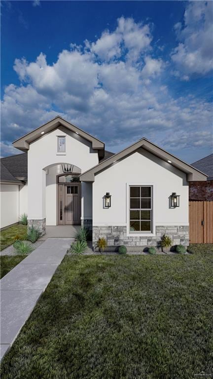 back of house featuring stone siding, a lawn, and stucco siding