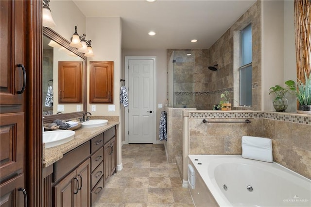 2703 Grand Canal Dr, Mission, TX 78572 - bathroom with a stall shower, a tub with jets, double vanity, recessed lighting, and baseboards
