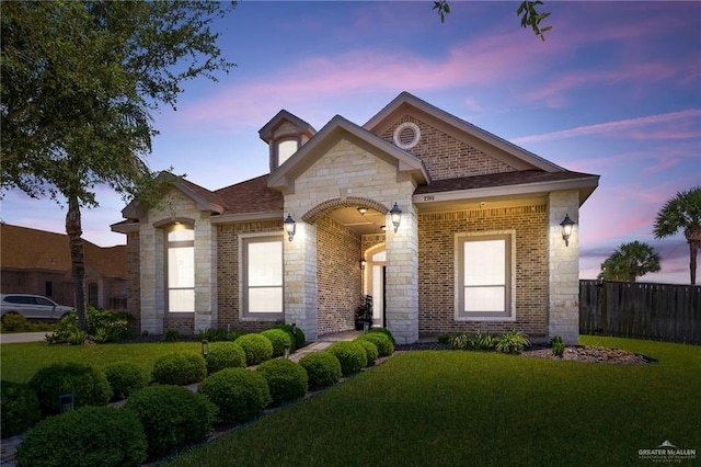 2703 Grand Canal Dr, Mission, TX 78572 - french country home featuring brick siding and stone siding