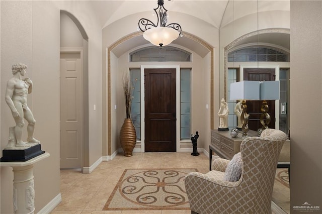 2703 Grand Canal Dr, Mission, TX 78572 - foyer with arched walkways, baseboards, and tile patterned flooring