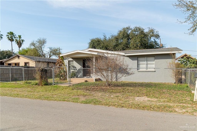 view of front facade with a fenced front yard and stucco siding