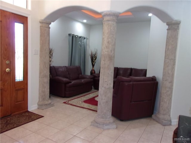 1614 Sheri Lee Dr, Mission, TX 78574 - foyer entrance with baseboards, decorative columns, arched walkways, and tile patterned flooring