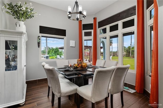 dining area with plenty of natural light and an inviting chandelier