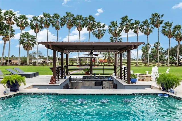 view of swimming pool featuring area for grilling, a yard, and a patio