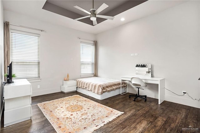 bedroom featuring multiple windows, ceiling fan, and dark wood-type flooring