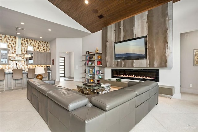 living room featuring a large fireplace, high vaulted ceiling, and wood ceiling