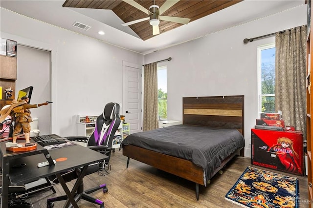 bedroom with hardwood / wood-style floors, ceiling fan, wood ceiling, and vaulted ceiling