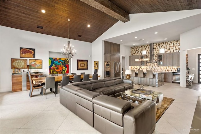 living room featuring beamed ceiling, wooden ceiling, high vaulted ceiling, and a chandelier