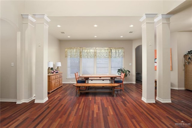 dining area featuring crown molding and dark hardwood / wood-style floors