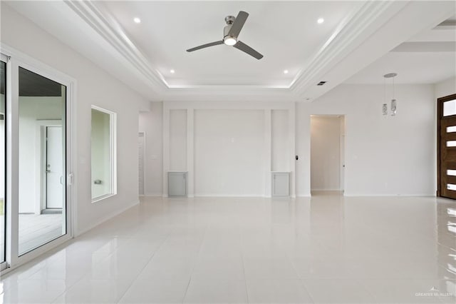 unfurnished room with a ceiling fan, visible vents, light tile patterned floors, a raised ceiling, and recessed lighting