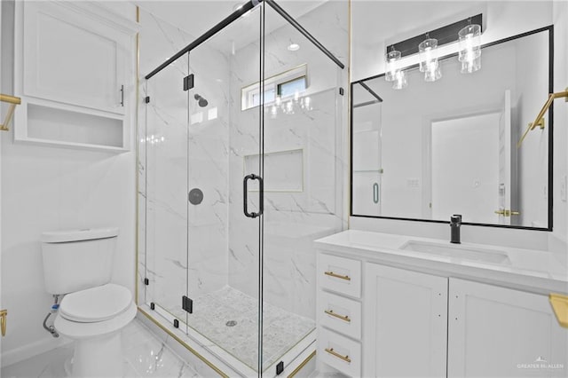 bathroom with marble finish floor, vanity, and a marble finish shower