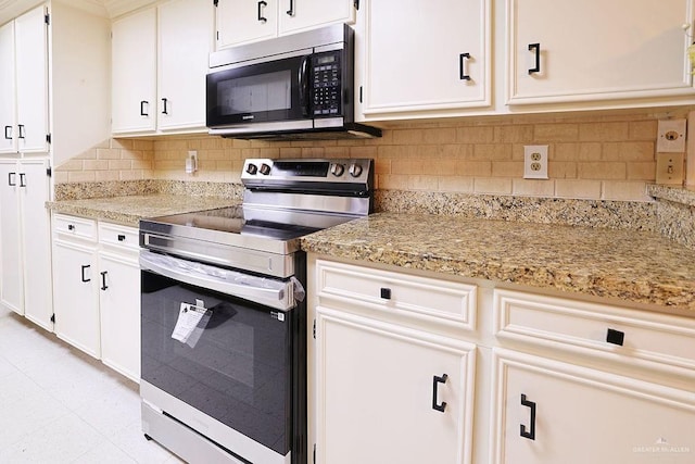 3208 Kiwi Ave, Mcallen, TX 78504 - kitchen with stainless steel electric stove, backsplash, white cabinets, and light stone counters