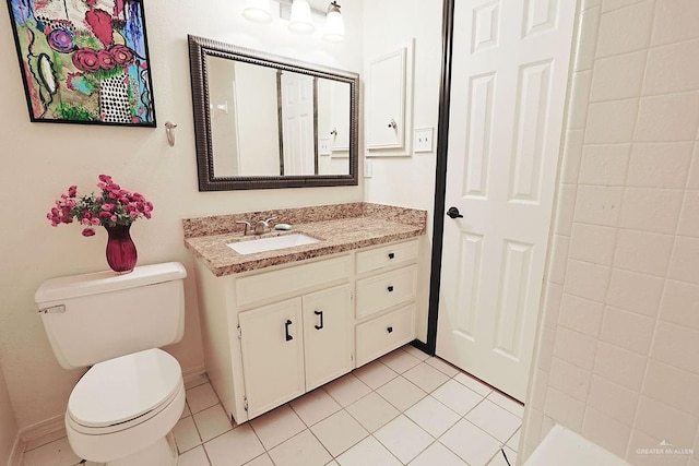 3208 Kiwi Ave, Mcallen, TX 78504 - bathroom featuring vanity, toilet, tile patterned floors, and baseboards