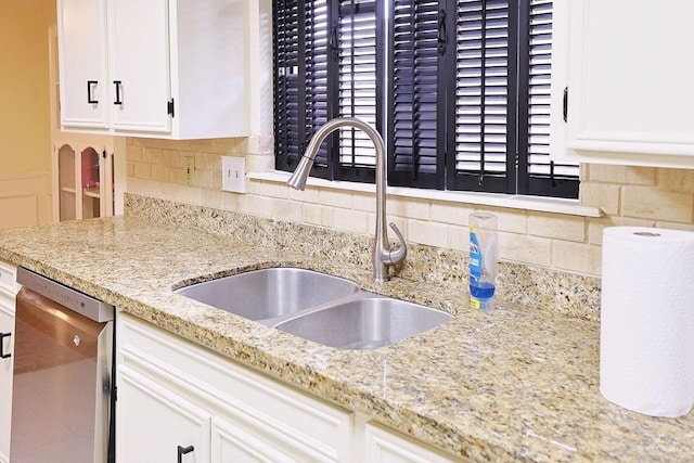 3208 Kiwi Ave, Mcallen, TX 78504 - kitchen with a sink, dishwasher, white cabinetry, and tasteful backsplash