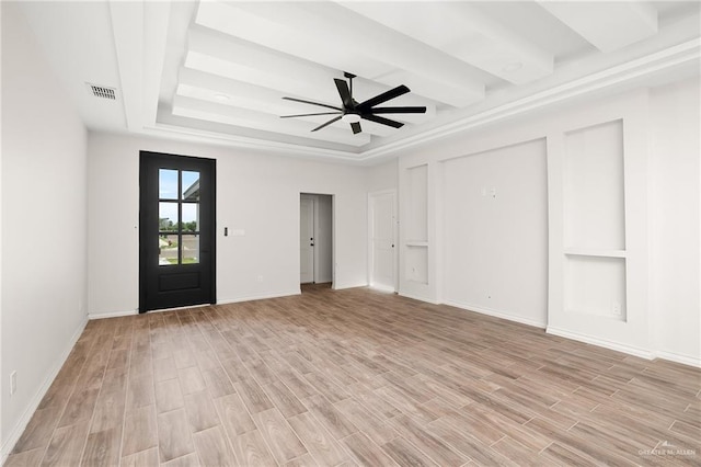 interior space featuring a raised ceiling, light hardwood / wood-style flooring, and ceiling fan