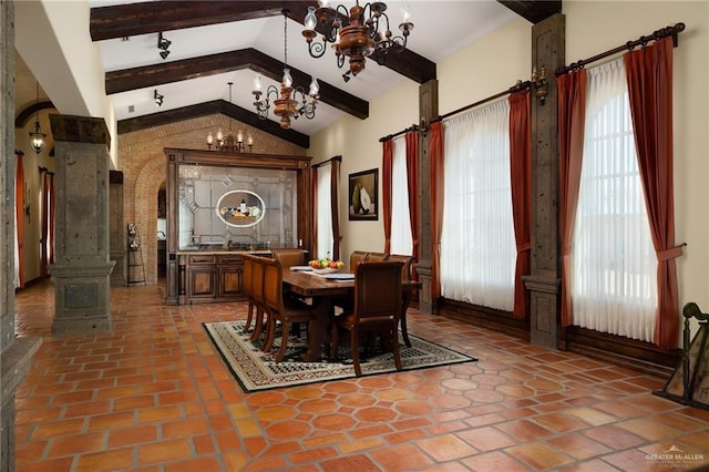 dining area with vaulted ceiling with beams and a chandelier