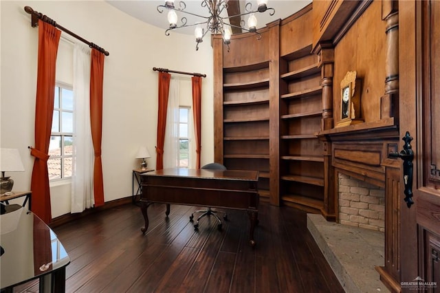 office area featuring a chandelier and dark wood-type flooring