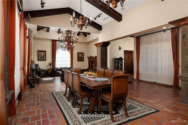 dining area with beamed ceiling, high vaulted ceiling, and an inviting chandelier