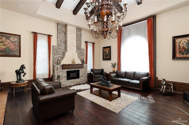 living room with hardwood / wood-style floors, an inviting chandelier, and plenty of natural light