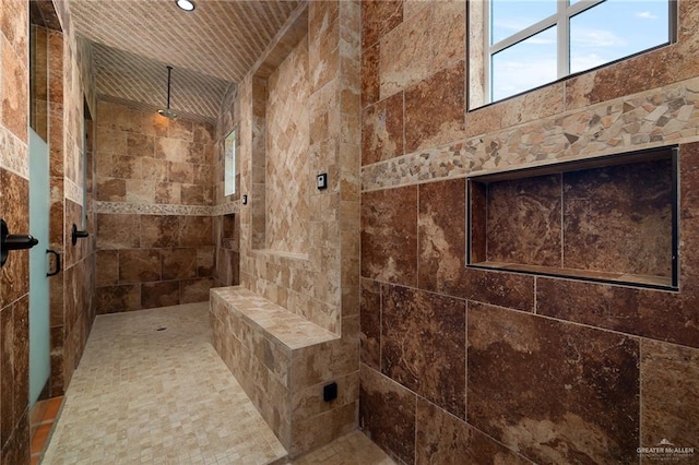 bathroom featuring a tile shower