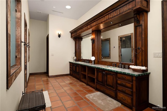 bathroom featuring tile patterned flooring and vanity