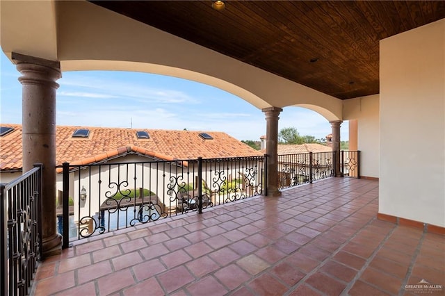 view of patio featuring a balcony