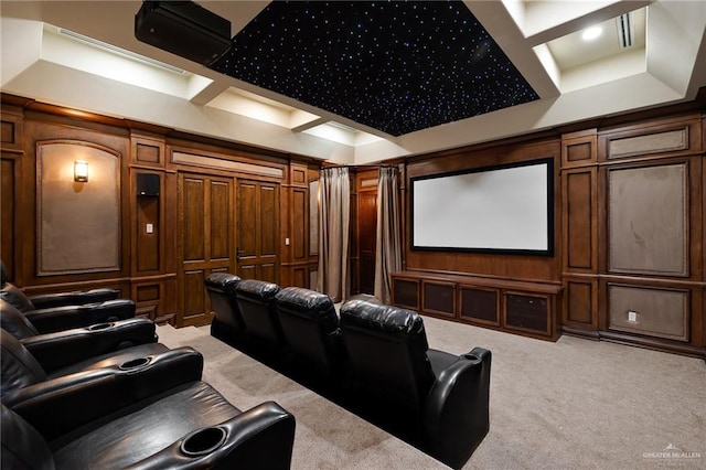 carpeted cinema room with coffered ceiling