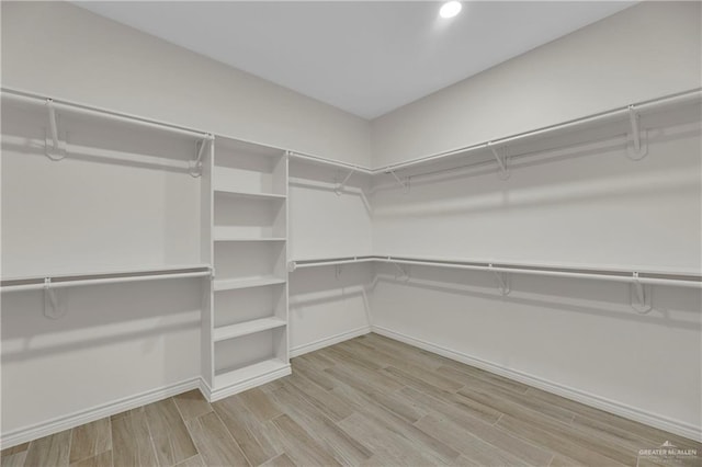 spacious closet with light wood finished floors