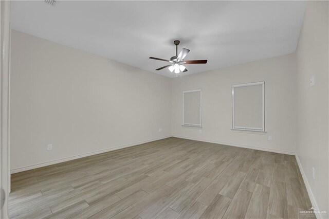 office space featuring ceiling fan and light hardwood / wood-style flooring