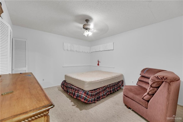 405 S 29th St, Mcallen, TX 78501 - carpeted bedroom with ceiling fan and a textured ceiling