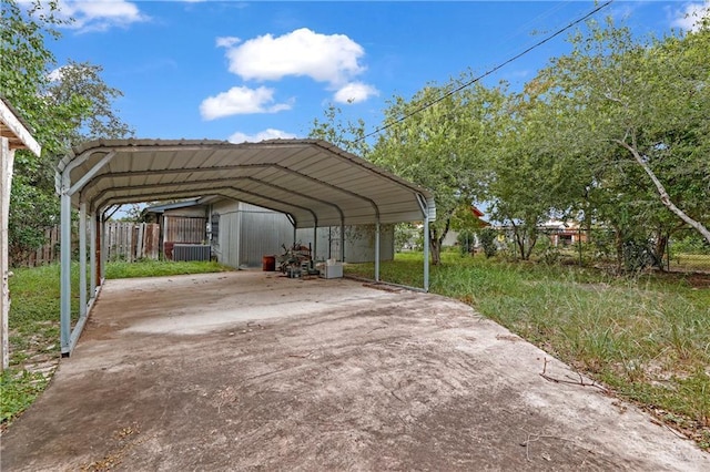 405 S 29th St, Mcallen, TX 78501 - view of vehicle parking featuring a detached carport, fence, and driveway