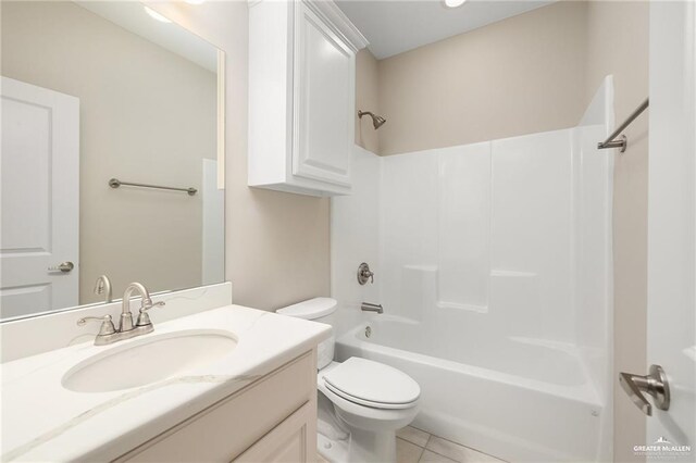 full bathroom with tile patterned flooring, vanity, shower / washtub combination, and toilet