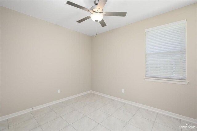 tiled empty room with ceiling fan