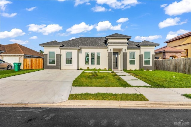 prairie-style home with a front lawn