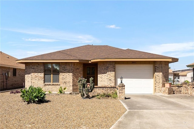 ranch-style house with an attached garage, brick siding, driveway, and a shingled roof