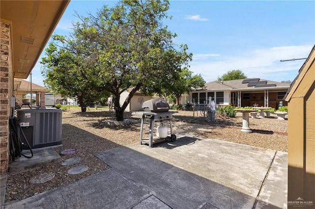 view of patio featuring area for grilling and central AC