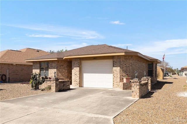 ranch-style home with brick siding, driveway, and a garage