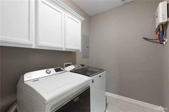 laundry room featuring electric panel, cabinet space, independent washer and dryer, and baseboards