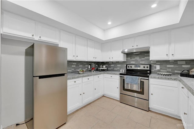 kitchen with backsplash, light stone counters, white cabinets, and stainless steel appliances