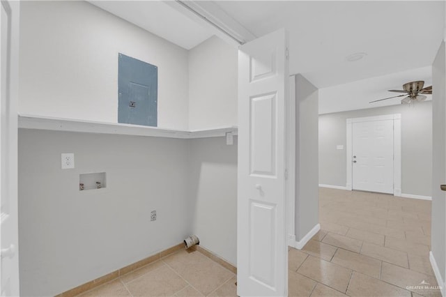 laundry room featuring electric panel, ceiling fan, light tile patterned floors, and washer hookup