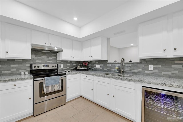 kitchen with stainless steel range with electric cooktop, sink, tasteful backsplash, white cabinetry, and beverage cooler