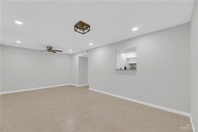 unfurnished room with ceiling fan