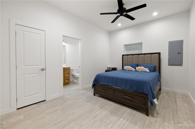 11115 N La Homa Rd, Mission, TX 78574 - bedroom with electric panel, light wood finished floors, baseboards, recessed lighting, and ensuite bath